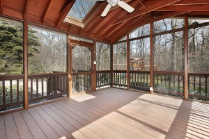 Porch in suburban home with wood beams and skylight